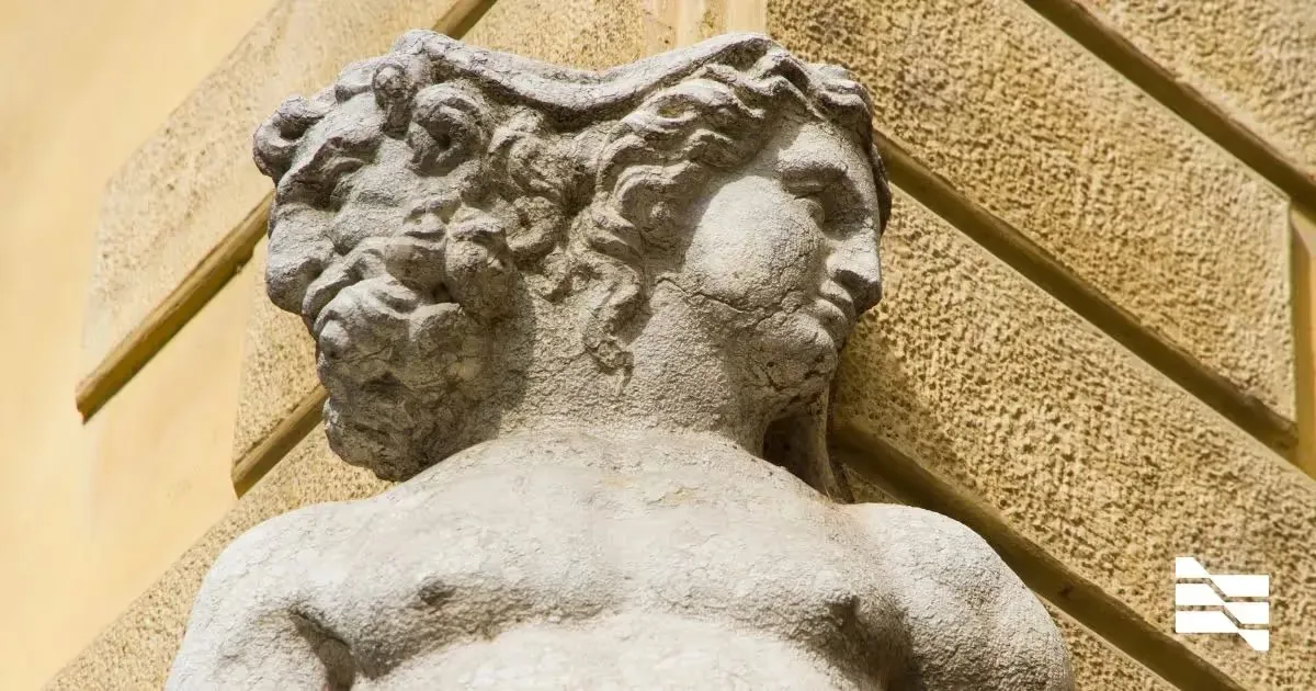 Ancient statue detail, capturing the contemplative spirit of transitioning from traditional employment to the independence of freelance work.